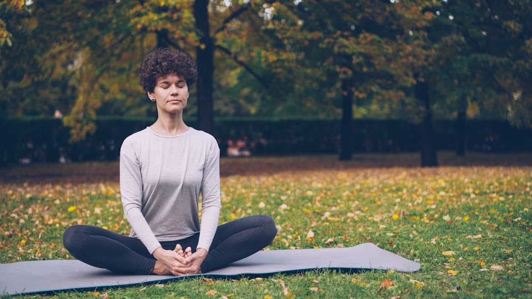 A woman in a calm seated yoga practice